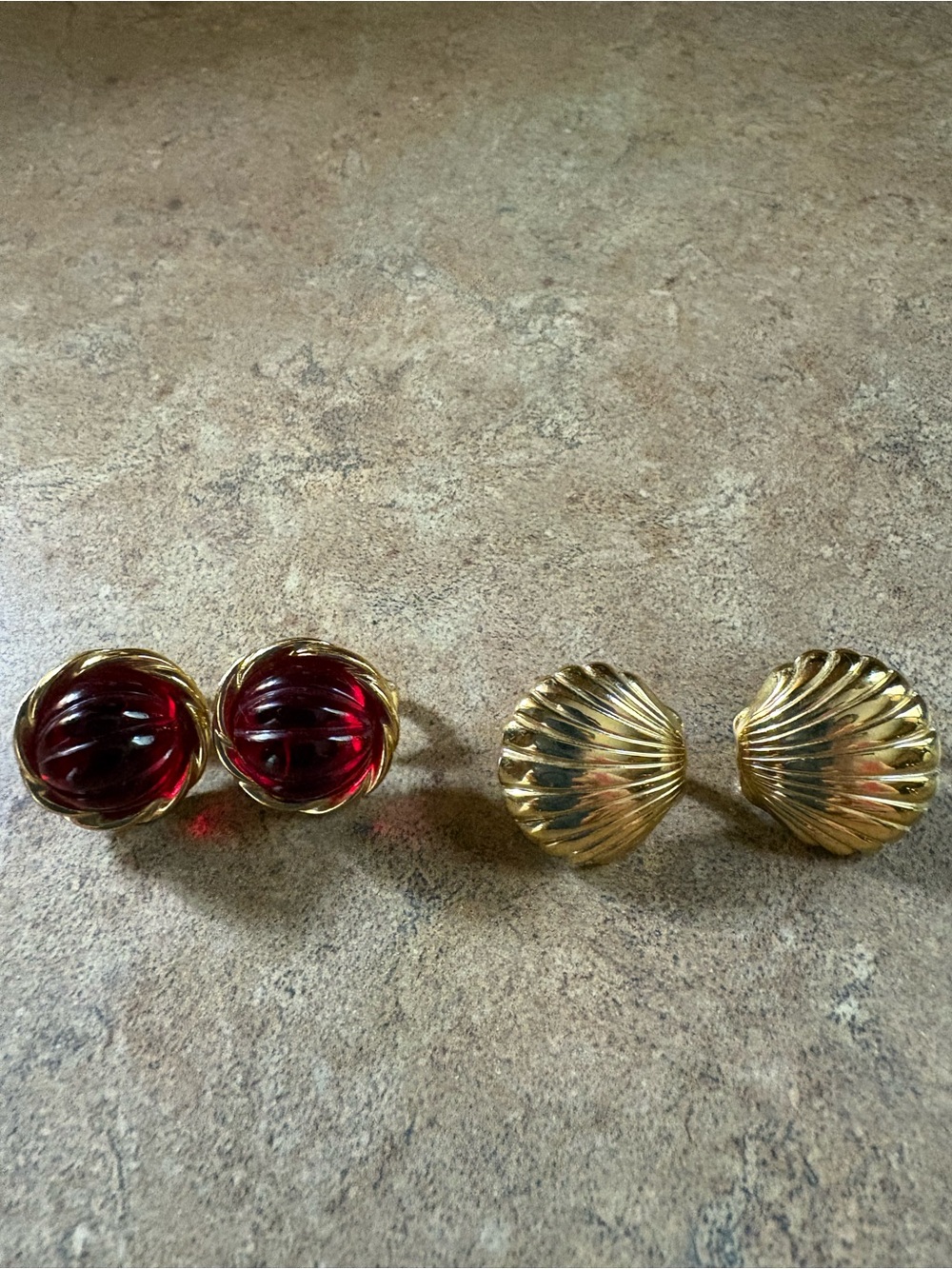 2 pairs clip on earrings. Pre owned. Ruby red and sea shell.